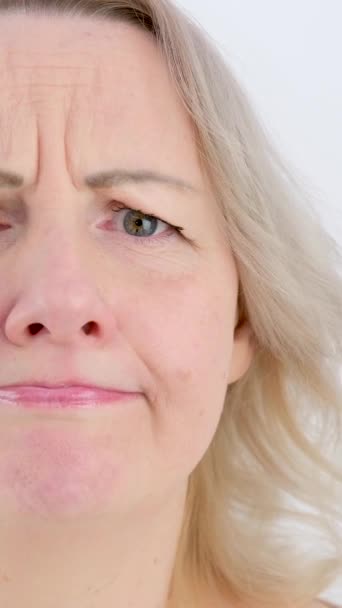 Photo Thoughtful Woman Bites Lower Lip Looks Dreamy Expression Aside — Stock Video