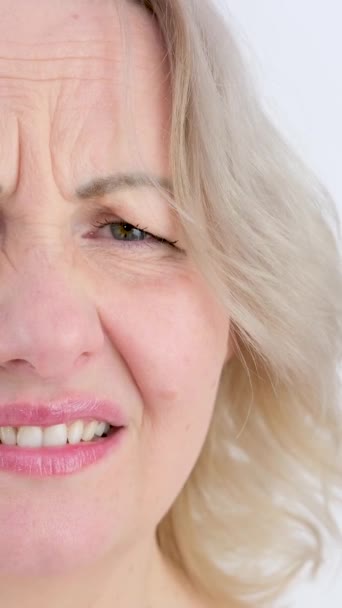Photo Thoughtful Woman Bites Lower Lip Looks Dreamy Expression Aside — Video Stock