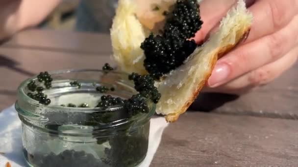 Glass Jar Wooden Spoon Scoop Black Caviar Bun Croissant Tasting — Stock Video