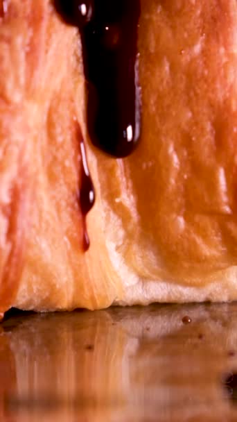 Drop Chocolate Syrup Hot Chocolate Slowly Flows Freshly Baked Croissant — Stock Video