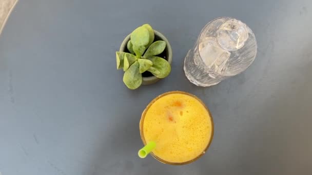Delicious Orange Juice Ice Hot Day Gray Table Female Hand — Stock Video