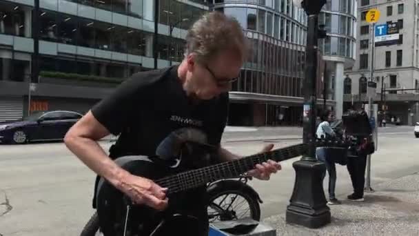Old Rock Musician Outdoors Playing Electric Guitar Sky Train Entrance — Stock Video