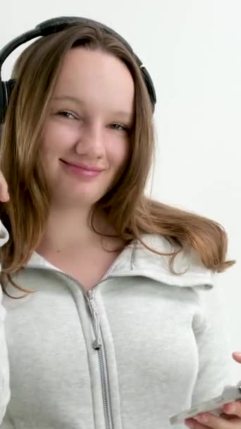 Girl Her Finger Taps Headphones Large Professional Headphones Listen Music — Stock Video