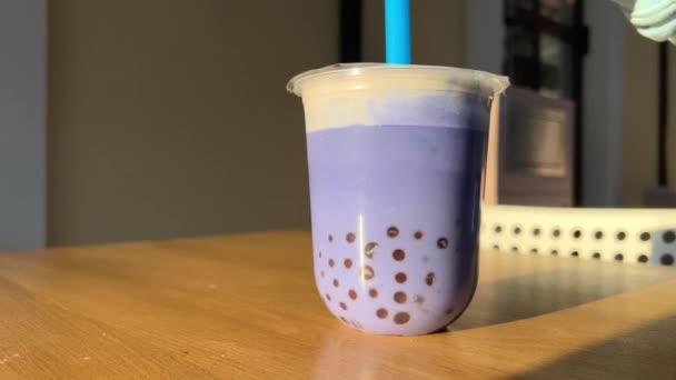 Blue Lilac Purple Bubble Tea Wooden Table Stirred Plastic Blue — Stock Video