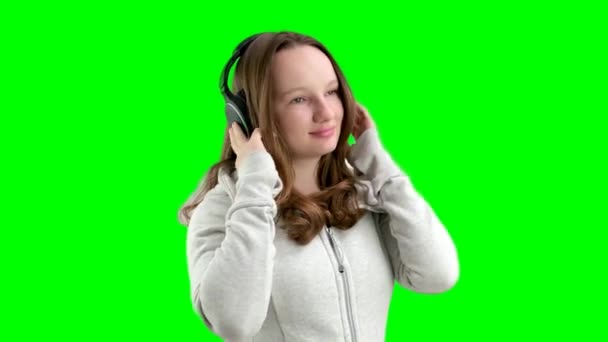 Teenage Girl Listens Music Large Professional Headphones White Background Sports — Stock Video