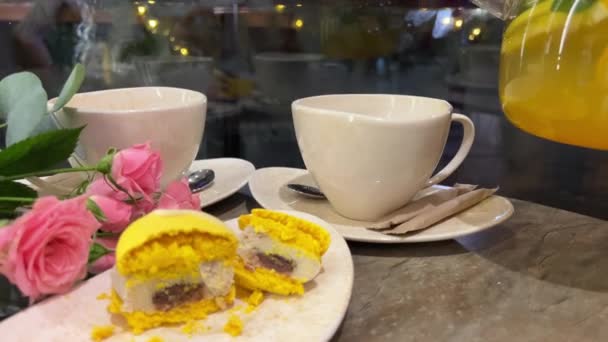 Yellow Macaroons Citrus Tea Pouring Hot Drink White Mug Pink — Stock Video