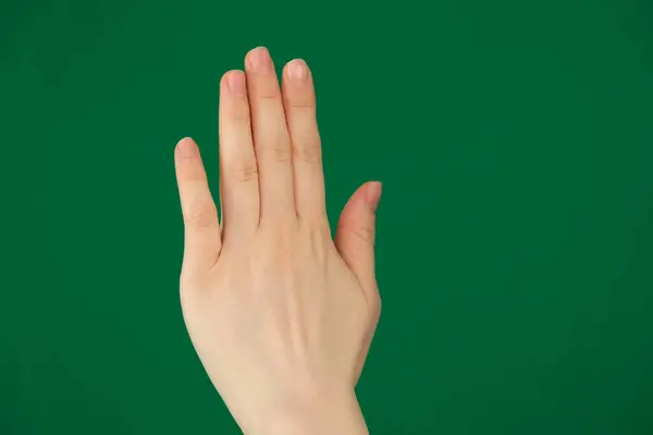 Palm with fingers stuck. Womans hand. High quality photo