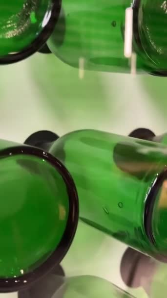 Close Dolly Shot Tops Openings Stacked Green Glass Bottles White — Stock Video
