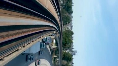 Train is traveling on road towards another skytrain coming from the front window this is driverless subway train is coming from Surrey Slow motion video is visible All around. canada Vancouver 07.2022