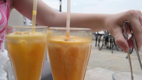 Fruit Juice Ice Cubes Glass Cup Closeup Fresh Orange Drink — Stock Video