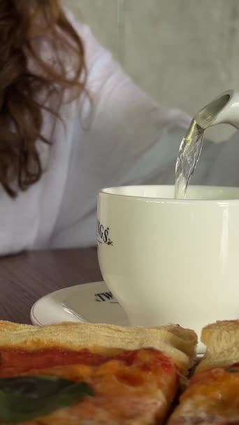 Woman Pouring Tea Teapot Glass Assortments Dish Table — Stock Video