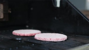 Preparation of beef cutlets. cutlet is fried in a grill pan, close-up
