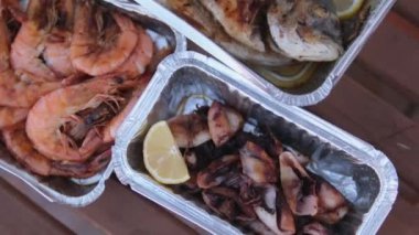 Serve in disposable containers, eat with hands outside. Seafood picnic shrimp squid fish