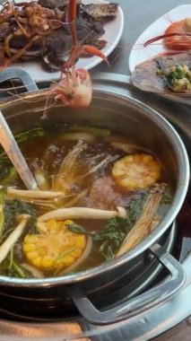 Cook shrimp soup Japanese hot pot dish concept. Japanese food.