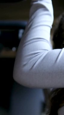 Woman doing pull-up. Strong girl in sportswear doing pull up exercise. H3althy