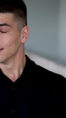 Portrait of Caucasian shocked business man entrepreneur looking at camera opens mouth wide in surprise of unexpected win, shouts. Close-up employee with expression of horror, fear sitting in office