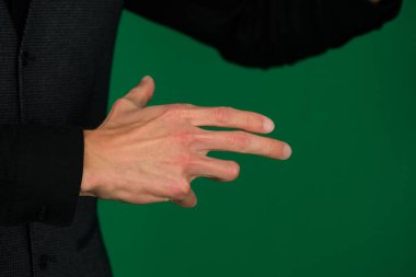 Female hand gestures on green screen: pointing or pressing. High quality photo clipart