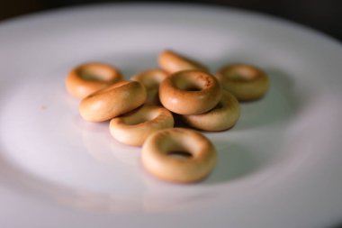 small bagels pretzels Delicious dry bagels sushki or baranki isolated on white background . High quality photo clipart