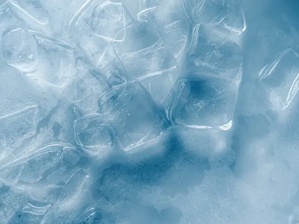 stock image icecubes background,icecubes texture,icecubes wallpaper,ice helps to feel refreshed and cool water from the icecubes helps the water refresh your life and feel good.ice drinks for refreshment business