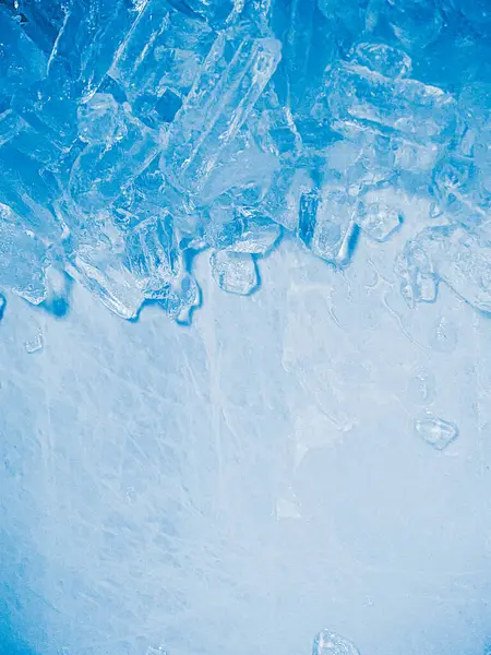 stock image icecubes background,icecubes texture,icecubes wallpaper,ice helps to feel refreshed and cool water from the icecubes helps the water refresh your life and feel good.ice drinks for refreshment business