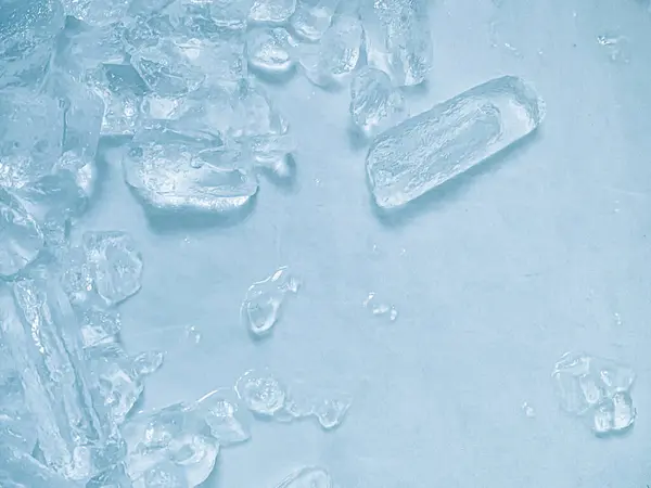 stock image icecubes background,icecubes texture,icecubes wallpaper,ice helps to feel refreshed and cool water from the icecubes helps the water refresh your life and feel good.ice drinks for refreshment business