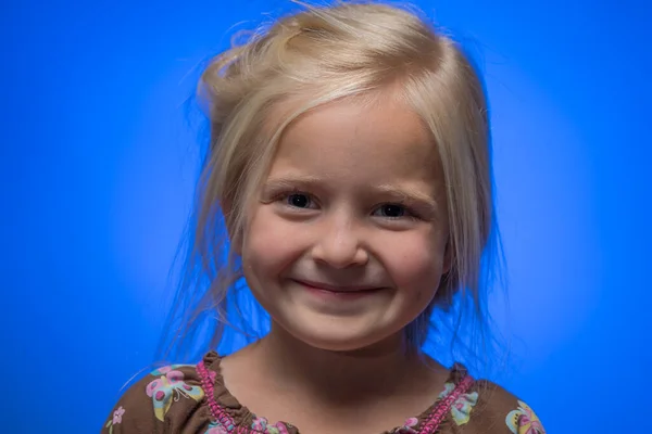 stock image Cute Little Girl Against a Blue Background