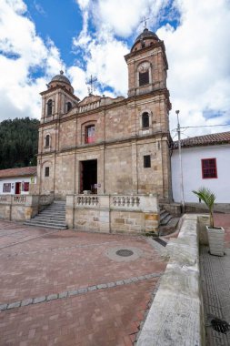 Nemocon, Cundinamarca, Colombia. July 2, 2021: Facade of San Francisco de Ass church and blue sky.