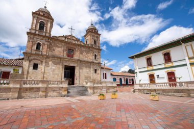 Nemocon, Cundinamarca, Colombia. July 2, 2021: Facade of San Francisco de Ass church and blue sky.