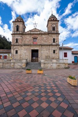 Nemocon, Cundinamarca, Colombia. July 2, 2021: Facade of San Francisco de Ass church and blue sky.