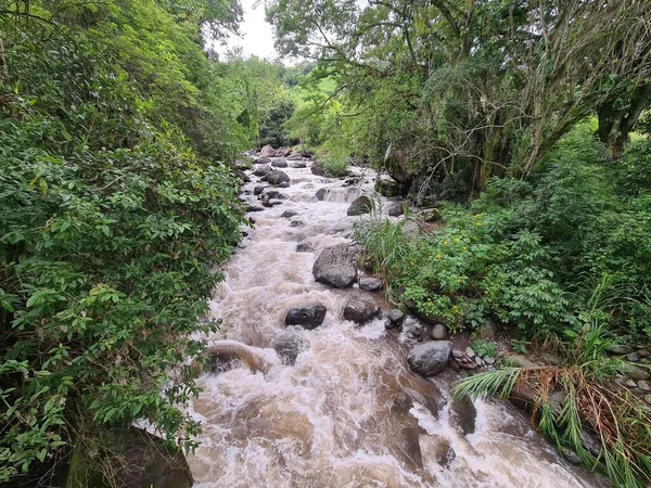 stock image Landscape of the Cartama river with blue sky. Stones in the river. Tamesis, Antioquia, Colombia. 