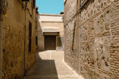 Toledo, Espaa. April 29, 2022: Streets and facades in the city of Toledo with blue sky.