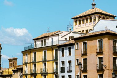 Toledo, Espaa. April 29, 2022: City buildings with colorful facade and blue sky.