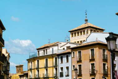 Toledo, Espaa. April 29, 2022: City buildings with colorful facade and blue sky.