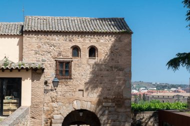 Toledo, Spain. April 5, 2022: Walls and fortresses of Toledo with beautiful blue sky.