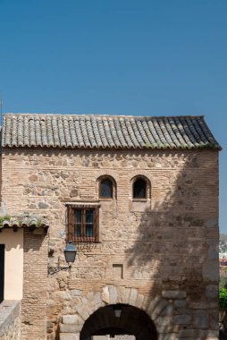 Toledo, Spain. April 5, 2022: Walls and fortresses of Toledo with beautiful blue sky.
