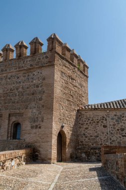 Toledo, Spain. April 5, 2022: Walls and fortresses of Toledo with beautiful blue sky.