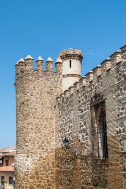 Toledo, Spain. April 5, 2022: Walls and fortresses of Toledo with beautiful blue sky.