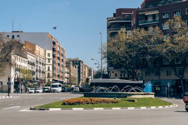 Madrid, Spain. April 5, 2022: Blue buses and means of transport in the city with blue sky.