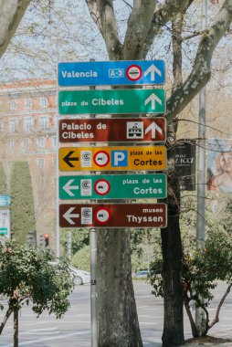 Madrid, Spain. April 6, 2022: City traffic signals. Traffic lights and signage.