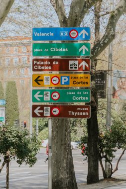 Madrid, Spain. April 6, 2022: City traffic signals. Traffic lights and signage.