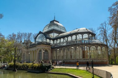 Madrid, Spain. April 6, 2022: Crystal palace facade and architecture with blue sky.