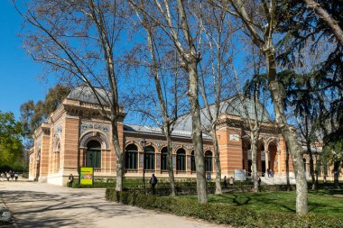 Madrid, Spain. April 6, 2022: Crystal palace facade and architecture with blue sky