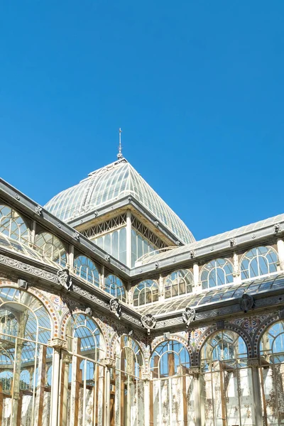 Madrid, Spain. April 6, 2022: Crystal palace facade and architecture with blue sky.