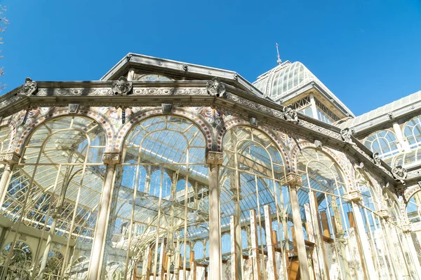 Madrid, Spain. April 6, 2022: Crystal palace facade and architecture with blue sky.