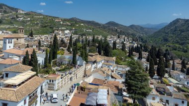 Sacromonte gypsy neighborhood with panoramic landscape and blue sky. Granada, Spain.