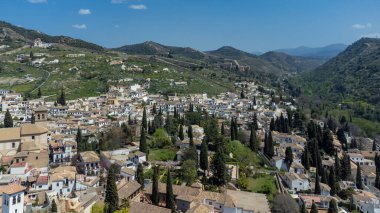 Sacromonte gypsy neighborhood with panoramic landscape and blue sky. Granada, Spain.