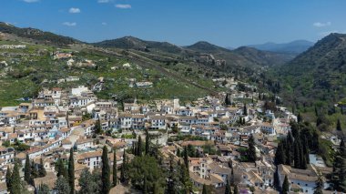 Sacromonte gypsy neighborhood with panoramic landscape and blue sky. Granada, Spain.