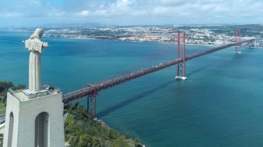 Lisbon, Portugal. April 11, 2022: Panoramic landscape with a view of the Tagus river and 25 de Abril bridge.