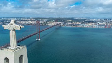 Lisbon, Portugal. April 11, 2022: Panoramic landscape with a view of the Tagus river and 25 de Abril bridge.
