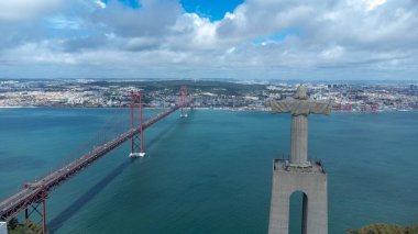 Lisbon, Portugal. April 11, 2022: Panoramic landscape with a view of the Tagus river and 25 de Abril bridge.